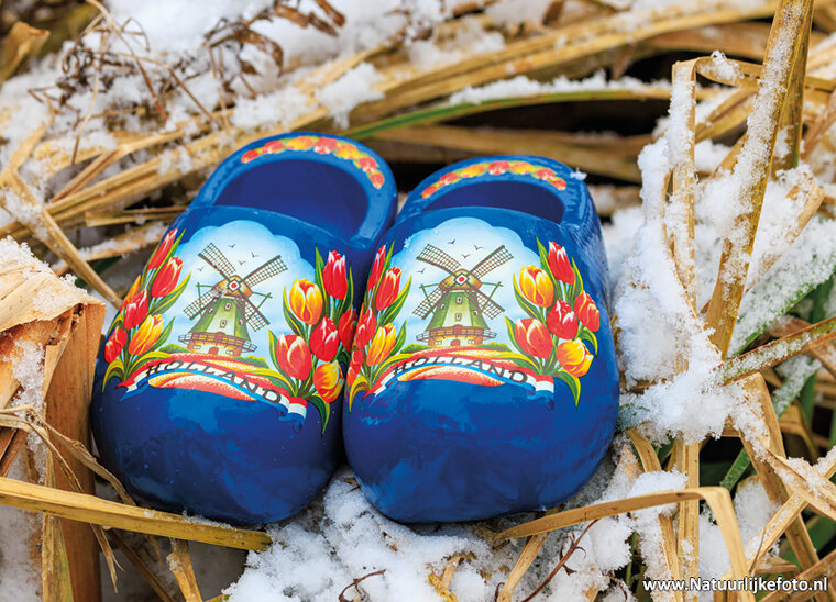 postcard blue clogs in snow